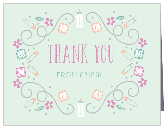 Bottles and blocks, safety pins and dots mingle with florals and swirls on the ABC Blocks Thank You Cards.