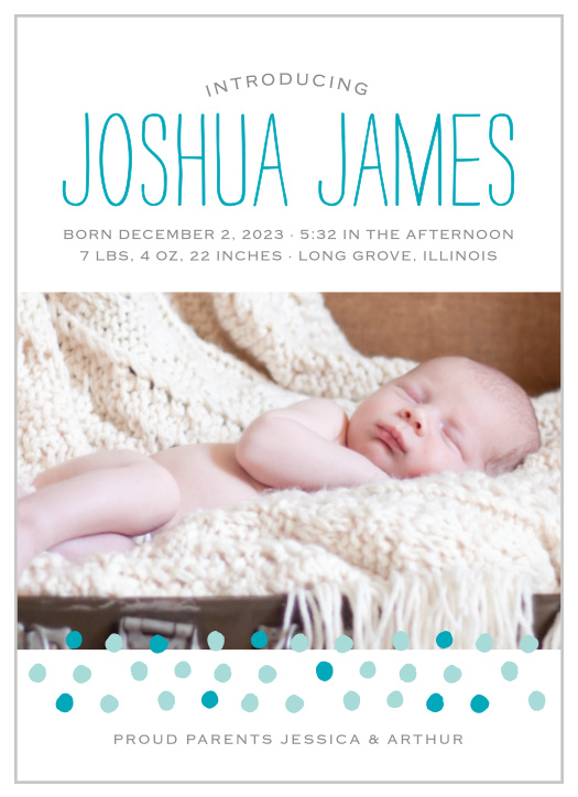 Dots speckle the bottom of your child’s photo on the Painted Dots Birth Announcements.