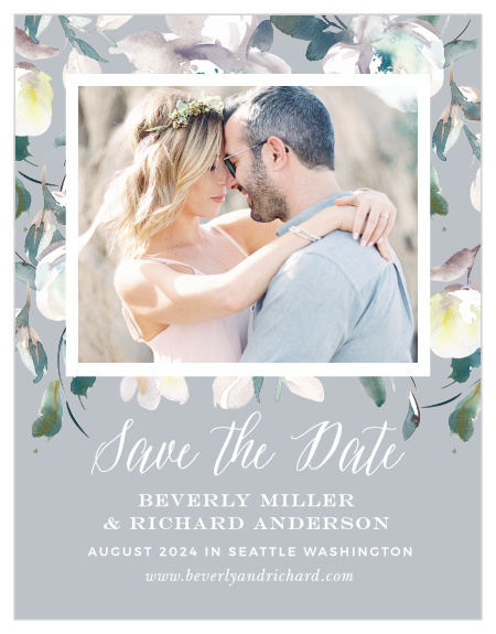 The Antique Blooms Save-the-Date Cards feature vintage, watercolored florals framing your gorgeous engagement photo atop a moonstone background.