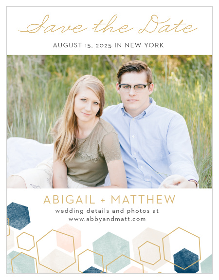 A geometric pattern in pink and blue hues with some gold hexagon outlines graces the bottom of our Geometric Watercolor Save-the-Date Cards.