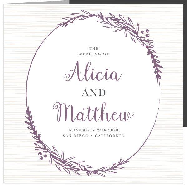 A subtle wood grain background and a frame of foliage decorate the front of the Delicate Laurel Storybook Wedding Invitations.