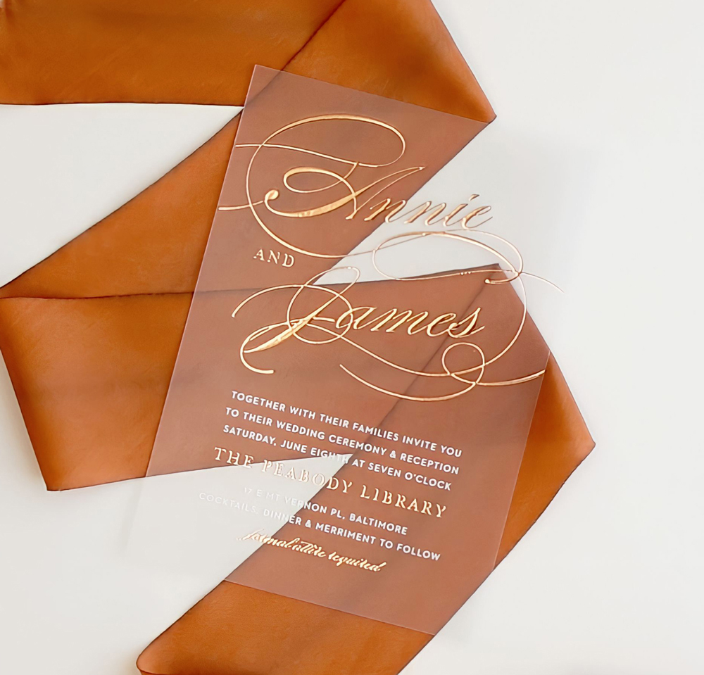 Clear, foiled wedding
      invitations